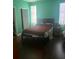 Bedroom with hardwood floors, bed and natural light at 14 Lockwood Dr # 1-F, Charleston, SC 29401