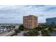 Exterior view of a multi-story apartment building with parking and greenery at 14 Lockwood Dr # 1-F, Charleston, SC 29401