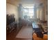 Bright living room with comfy seating, rug, and large window at 14 Lockwood Dr # 1-F, Charleston, SC 29401