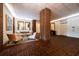 Elegant lobby with brick columns, herringbone floors, and seating area at 14 Lockwood Dr # 1-F, Charleston, SC 29401
