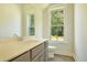 Charming powder room with a bright window and stylish vanity at 1425 Clay Field Trl, Summerville, SC 29485
