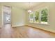 Well-lit dining room with hardwood flooring and modern light fixture at 1425 Clay Field Trl, Summerville, SC 29485