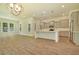 Open-concept living space combining the kitchen with a seating area at 1425 Clay Field Trl, Summerville, SC 29485