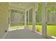 A bright screened-in porch with views of the lush green backyard at 1425 Clay Field Trl, Summerville, SC 29485