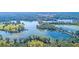 Expansive aerial view of a lake community with lush greenery, walking trails, and picturesque scenery at 157 Threaded Fern St, Summerville, SC 29485