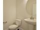 Half bathroom with a pedestal sink, toilet and base molding at 157 Threaded Fern St, Summerville, SC 29485