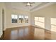 Spacious bedroom with ceiling fan, hardwood floors, three large windows and lots of natural light at 157 Threaded Fern St, Summerville, SC 29485