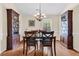 Dining room with hardwood floors, traditional furnishings, and a bright window at 1725 Henley Ln, Charleston, SC 29412