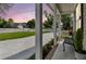 Inviting front porch showcasing neighborhood views and a comfortable sitting area at 1725 Henley Ln, Charleston, SC 29412