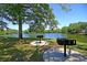 Community lakefront grilling area with convenient BBQ grills for outdoor gatherings and relaxation at 1725 Henley Ln, Charleston, SC 29412