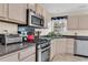 Functional kitchen features stainless steel appliances, light wood cabinets, and ample counter space at 1725 Henley Ln, Charleston, SC 29412