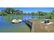Picturesque lake area with raft, picnic table and dock enhance outdoor enjoyment in the community at 1725 Henley Ln, Charleston, SC 29412