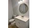 White bathroom with a gold-framed mirror and modern vanity at 1735 Boone Hall Dr # K6, Charleston, SC 29407