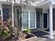 Charming brick townhome with dark shutters and blooming roses at 1735 Boone Hall Dr # K6, Charleston, SC 29407