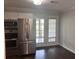 Kitchen with stainless steel appliances and access to the back patio at 1735 Boone Hall Dr # K6, Charleston, SC 29407