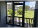 View of the fenced-in backyard from the screened-in back porch at 1735 Boone Hall Dr # K6, Charleston, SC 29407
