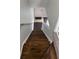 A wooden staircase leads down to a white front door and tile entryway at 1735 Boone Hall Dr # K6, Charleston, SC 29407