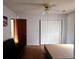 Bright bedroom with wood floors, closet and sliding doors and a futon at 18808 Round O Rd, Round O, SC 29474