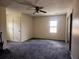 Spacious bedroom with carpet, ceiling fan, large closet, and a window at 18808 Round O Rd, Round O, SC 29474