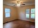 Bright bedroom with ceiling fan, hardwood floors and double window letting in lots of light at 18808 Round O Rd, Round O, SC 29474