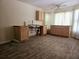 Simple kitchen featuring light wood cabinets, a sink, and dark vinyl flooring at 18808 Round O Rd, Round O, SC 29474