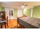 Bedroom with hardwood floors and a ceiling fan, with plenty of closet space at 192 Ashley Ave # C, Charleston, SC 29403
