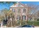 Charming multi-story home with unique architectural details, surrounded by lush trees and greenery at 192 Ashley Ave # C, Charleston, SC 29403
