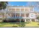 Stunning three-story home showcasing Southern charm with a grand facade and multiple balconies at 192 Ashley Ave # C, Charleston, SC 29403