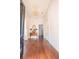 Bright foyer featuring hardwood floors, a decorative mirror, and a beautiful chandelier at 192 Ashley Ave # C, Charleston, SC 29403
