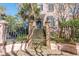 Charming home featuring a wrought iron gate and stairs leading to the front door with transom window at 192 Ashley Ave # C, Charleston, SC 29403