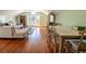 Bright and inviting living room with hardwood floors, a comfortable sofa, and a cozy dining area at 192 Ashley Ave # C, Charleston, SC 29403