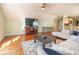 Bright living area with hardwood floors, comfortable sofa, and a kitchen area, perfect for relaxing and entertaining at 192 Ashley Ave # C, Charleston, SC 29403