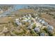 Scenic aerial view of homes nestled amongst trees near marsh and waterway at 2107 Club View Ct, Charleston, SC 29412
