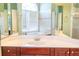 Bathroom with double vanity, large mirror, and separate tub and shower at 2107 Club View Ct, Charleston, SC 29412