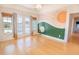 Sun-themed decor in the room with light hardwood floors and natural lighting at 2107 Club View Ct, Charleston, SC 29412