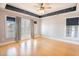 Bright bedroom with hardwood floors, ceiling fan, and star-themed ceiling detail at 2107 Club View Ct, Charleston, SC 29412
