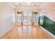 Sunny bedroom featuring a playful sun-themed mural, hardwood floors, and patio access at 2107 Club View Ct, Charleston, SC 29412