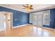 Large bedroom featuring hardwood floors and a private balcony at 2107 Club View Ct, Charleston, SC 29412