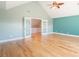 Cozy bedroom with vaulted ceiling, hardwood floors, and access to upstairs space at 2107 Club View Ct, Charleston, SC 29412