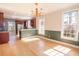 Open-concept dining area connects to the kitchen with hardwood floors and natural light at 2107 Club View Ct, Charleston, SC 29412