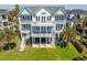 A spacious beach house with multi-level balconies offers stunning views from every angle at 2107 Club View Ct, Charleston, SC 29412