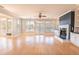 Bright living room featuring a fireplace, large windows, and access to outdoor balconies at 2107 Club View Ct, Charleston, SC 29412