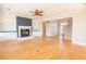 Cozy living room with fireplace, ceiling fan, and built-in shelving at 2107 Club View Ct, Charleston, SC 29412