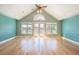 Open living room with vaulted ceiling, hardwood floors, and ample natural light at 2107 Club View Ct, Charleston, SC 29412
