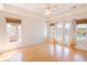 Bright main bedroom with wood floors, french doors, and natural light at 2107 Club View Ct, Charleston, SC 29412
