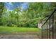 Lush backyard with mature trees and a storage shed at 211 Bramblewood Dr, Summerville, SC 29485