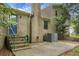 Brick backyard with a chimney, steps leading to a door, and a concrete patio perfect for outdoor gatherings at 211 Bramblewood Dr, Summerville, SC 29485