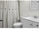 Clean bathroom with a white vanity, mirror, toilet, and shower featuring a button-accented curtain at 211 Bramblewood Dr, Summerville, SC 29485