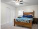 Bright bedroom featuring carpeted floors, a ceiling fan, and a double closet at 211 Bramblewood Dr, Summerville, SC 29485