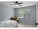 Bedroom with a ceiling fan, carpeted floors, and a window overlooking the backyard at 211 Bramblewood Dr, Summerville, SC 29485